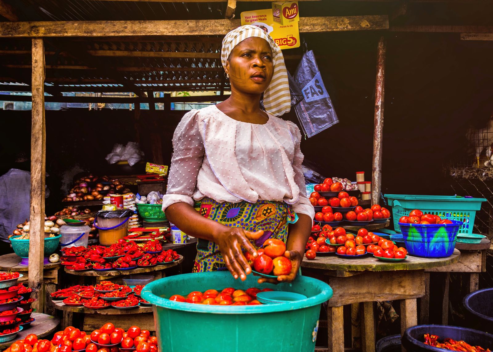 Trader selling fresh produce at an African street market