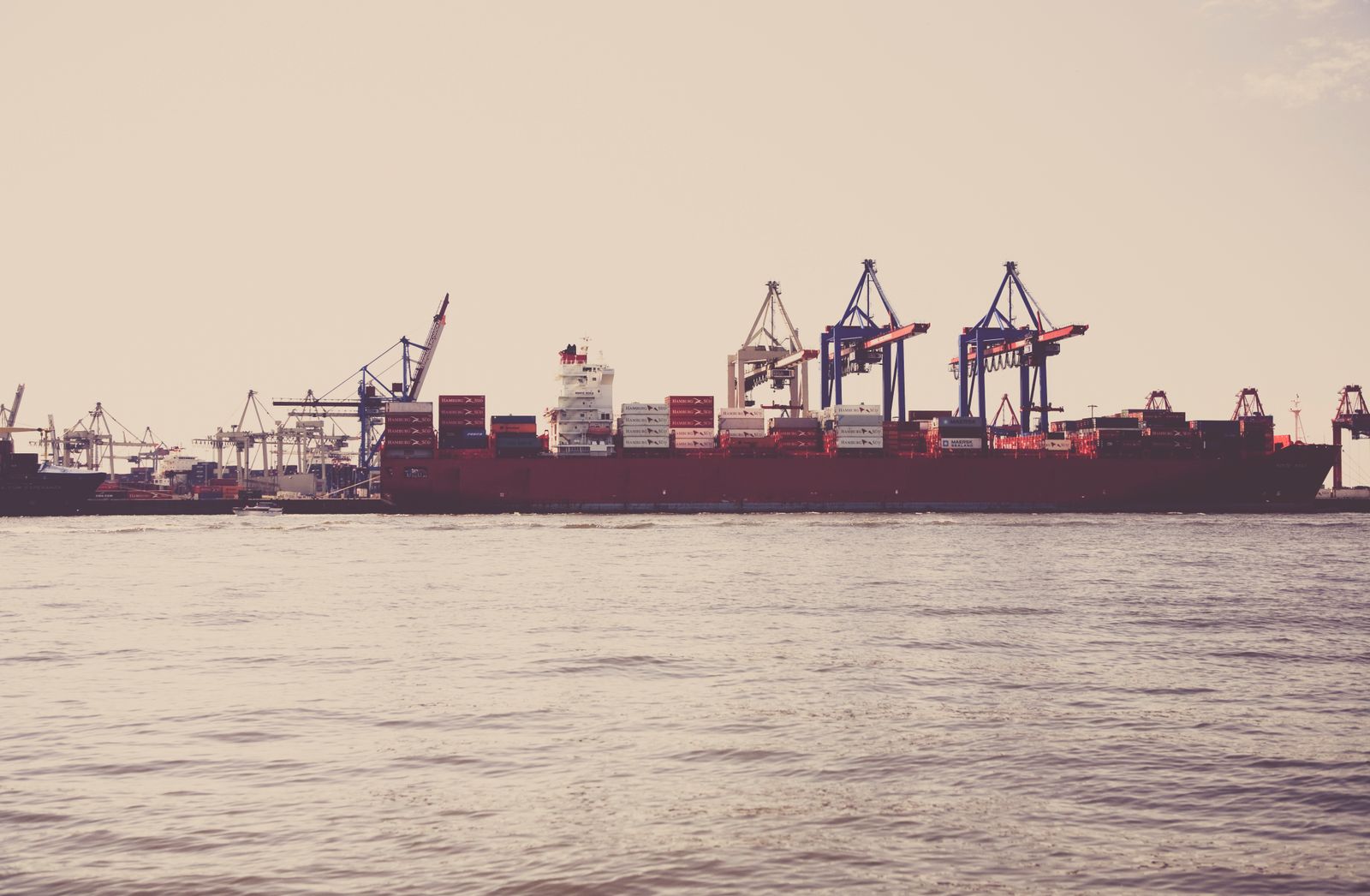 Cargo ship loaded with containers docked at a seaport